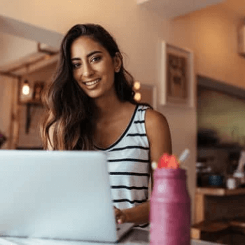 personal branding strategy, girl with computer getting ready to wrtite